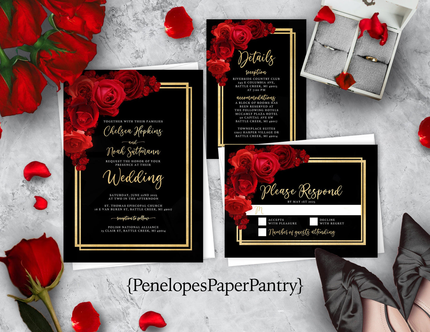 A set of wedding invitations with black background and red floral details, including an invitation, RSVP card, and details card, displayed with red roses and petals.