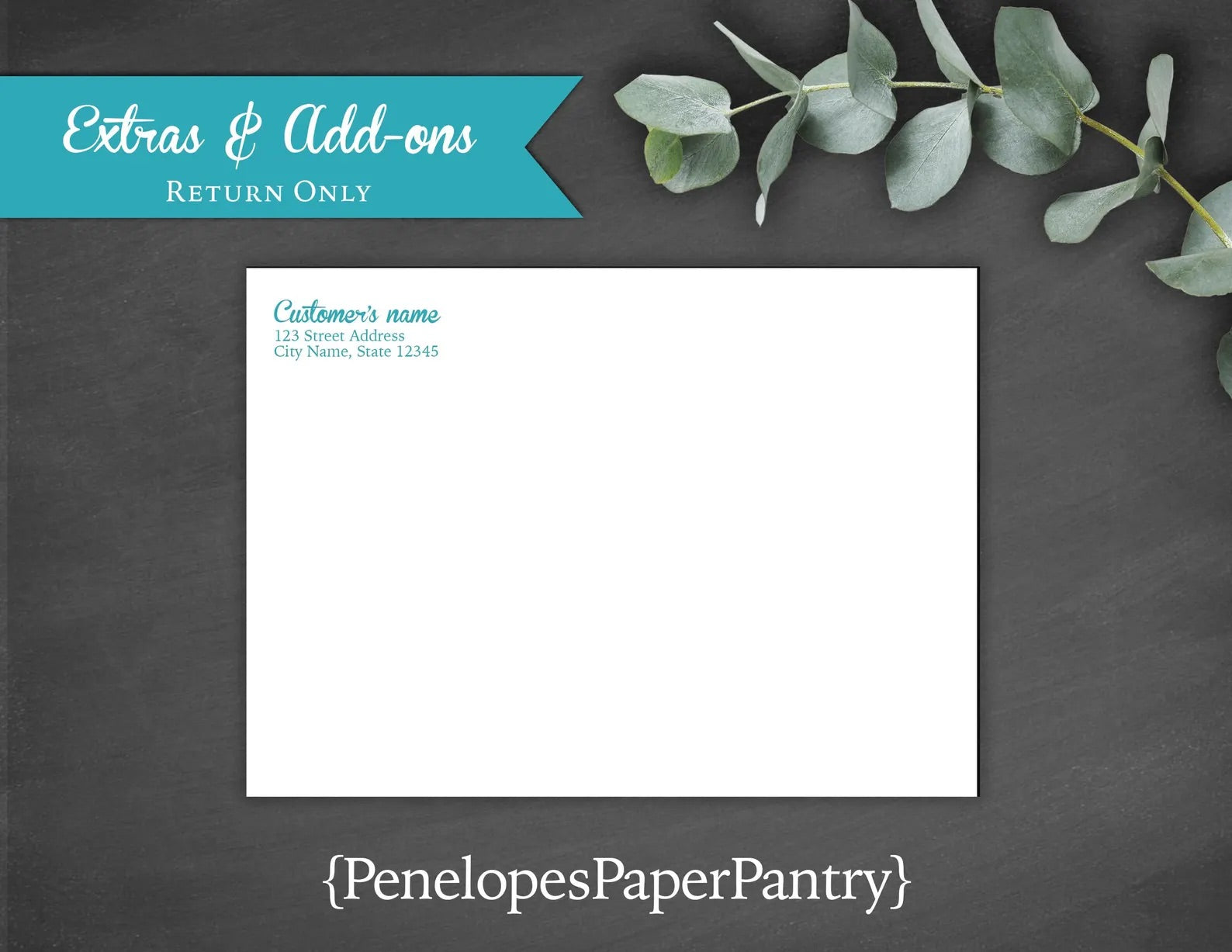 a white envelope with a blue ribbon and eucalyptus leaves